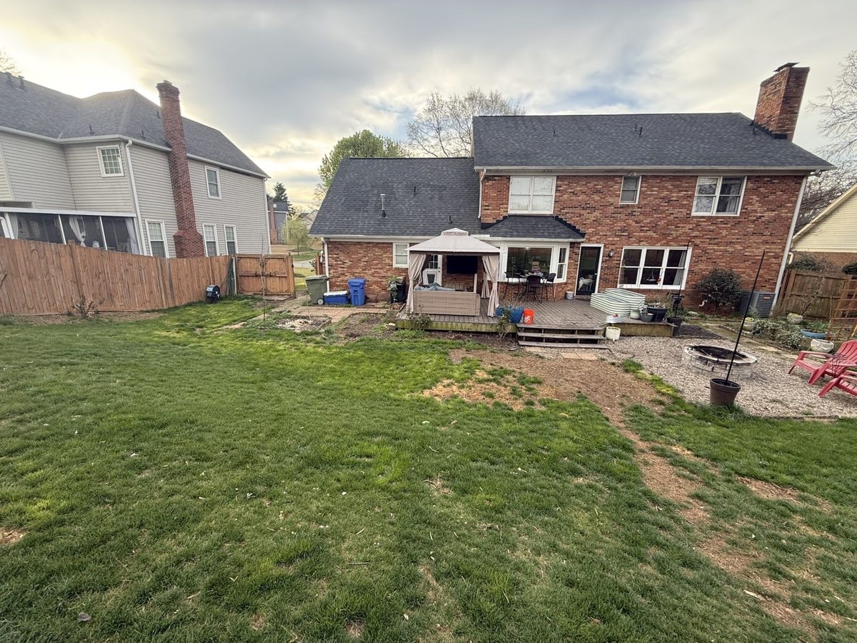 Before river rock drainage installation — soggy backyard Greenville SC