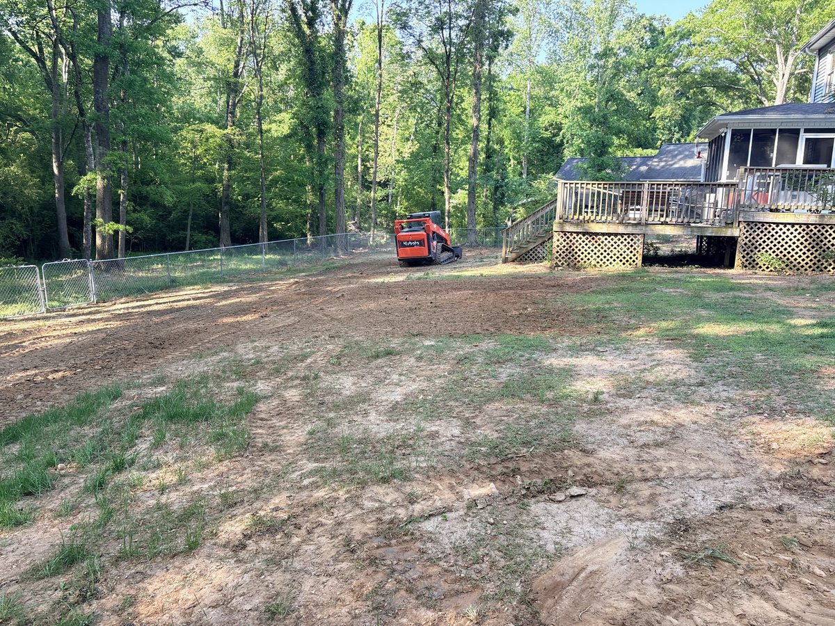Before land grading and topsoil — residential yard Greenville SC