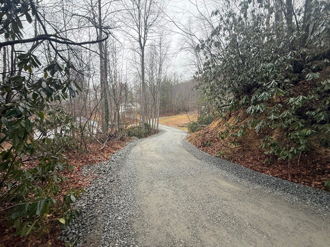 Gravel driveway installation Hendersonville NC — mountain driveway restoration after Hurricane Helene — Iron Lungs