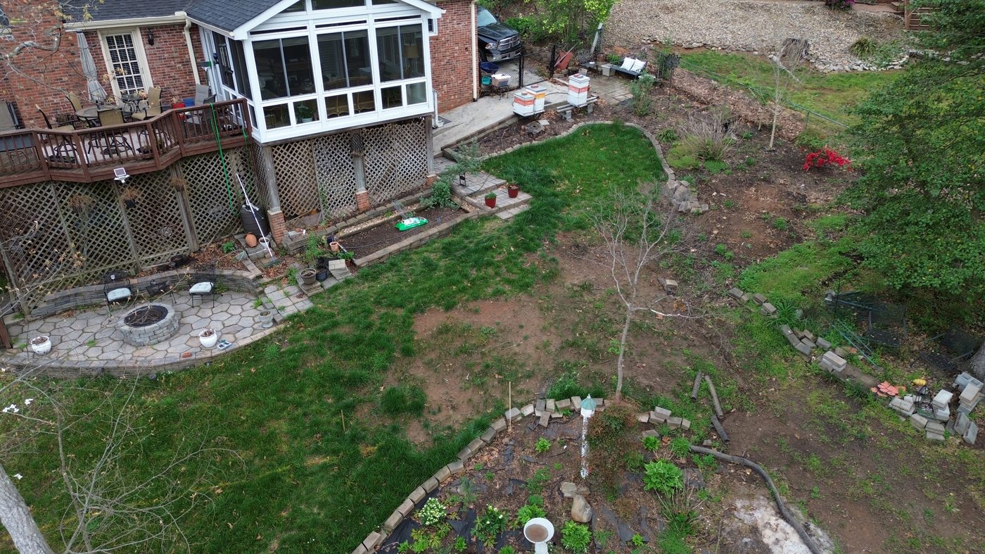 Before back yard renovation downtown Greenville SC — aerial view sloped unusable yard